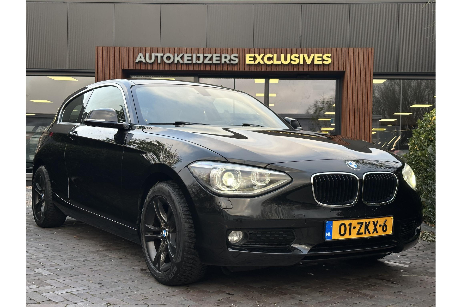 BMW 1-serie 114i Business+ 2013 Saphirschwarz metallic 1
